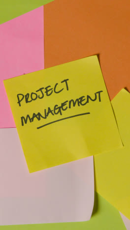 Vertical-Video-Business-Concept-Of-Revolving-Sticky-Notes-With-Project-Management-Written-On-Top-Note-1